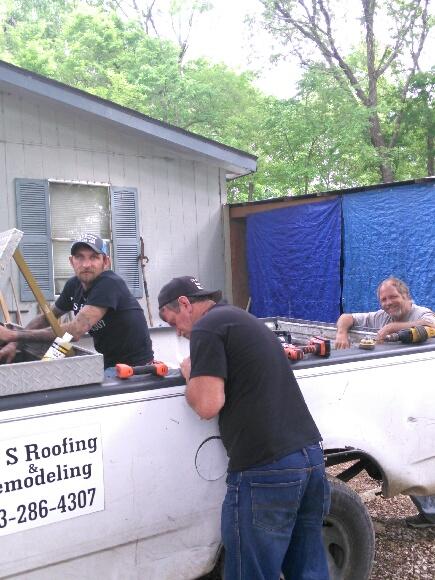 J&S Roofing crew at the truck